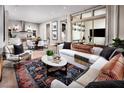 Bright living space with stylish decor, large windows, hardwood floors, and an open floor plan at 664 Agate Bridge St, Las Vegas, NV 89138