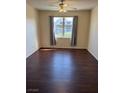 This bedroom is naturally bright and features dark wood flooring and neutral walls at 6955 N Durango Dr # 1038, Las Vegas, NV 89149