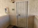 Front door with security gate at unit 2045 at 7300 Pirates Cove Rd # 2045, Las Vegas, NV 89145