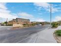View of the Magnolia Bay entrance sign with attractive landscaping in a gated community at 816 Sand Camel Ct, North Las Vegas, NV 89081