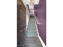 View of the home's stairway featuring decorative carpeting and purple accent wall at 9000 S Las Vegas Blvd # 2222, Las Vegas, NV 89123