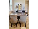 Comfortable dining area with seating for four and carpeted floors at 11593 Cedar Shore Ave, Las Vegas, NV 89138