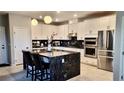 Elegant kitchen boasts stainless appliances, granite countertops, and a functional center island at 11593 Cedar Shore Ave, Las Vegas, NV 89138
