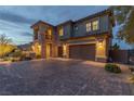Charming home with a spacious driveway, ample garage space, and beautifully manicured shrubs and trees at 2 Olympia Outlook Dr, Las Vegas, NV 89141