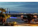 Outdoor seating area with a view of the city skyline at 2 Olympia Outlook Dr, Las Vegas, NV 89141