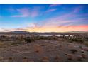 Expansive landscape view shows the desert terrain and nearby mountains against a colorful sky at 20 Via Visione # 104, Henderson, NV 89011