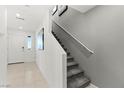 Clean and modern staircase with gray carpet and white walls at 321 Cymbal Pl # Lot 130, Henderson, NV 89015