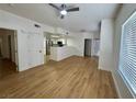 Bright and airy living room featuring wood-look flooring and an open floorplan at 3400 Cabana Dr # 1033, Las Vegas, NV 89122