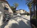 Community pool area with clubhouse, palm trees and blue skies above at 3400 Cabana Dr # 1033, Las Vegas, NV 89122
