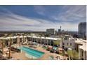 Beautiful aerial view of a sparkling community pool and cabanas, ideal for outdoor relaxation at 353 E Bonneville Ave # 125, Las Vegas, NV 89101