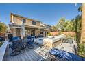 Outdoor living space with a built-in pool, patio seating, and mature landscaping at 5442 Bristol Bend Ct, Las Vegas, NV 89135