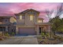 Charming two-story home featuring a covered entryway, landscaped yard, and attached two-car garage at 5442 Bristol Bend Ct, Las Vegas, NV 89135