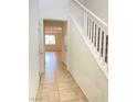 Home entryway featuring tile floors and a staircase at 5513 Silent Springs Dr, Las Vegas, NV 89122