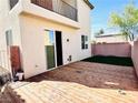 Private backyard with a wood deck, artificial grass, and privacy fence at 5634 Bishop Flowers St, Las Vegas, NV 89130