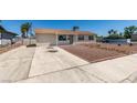 Single-story home with a gravel yard and concrete driveway at 6100 Fawn Cir, Las Vegas, NV 89107