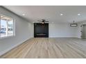 Spacious living room with modern fireplace and ceiling fan at 6100 Fawn Cir, Las Vegas, NV 89107