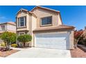 Two-story home with desert landscaping, a two-car garage, and a neutral color scheme at 6428 Yarmouth Dr, Las Vegas, NV 89108