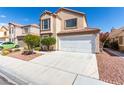 Two-story home with desert landscaping, a two-car garage, and a neutral color scheme at 6428 Yarmouth Dr, Las Vegas, NV 89108