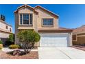 Two-story home with desert landscaping, a two-car garage, and a neutral color scheme at 6428 Yarmouth Dr, Las Vegas, NV 89108