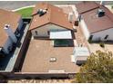 Aerial view of the backyard with gravel, a covered patio, block wall and a storage shed at 7268 Wichita Ct, Las Vegas, NV 89119