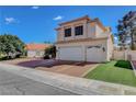 Charming home featuring a spacious three-car garage, low maintenance front yard, and inviting curb appeal at 7817 Safari Ln, Las Vegas, NV 89129