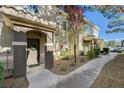 Close up exterior of a townhome with an inviting covered front entrance at 9050 W Warm Springs Rd # 1074, Las Vegas, NV 89148