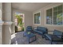 Cozy covered patio featuring stone pavers and comfortable seating, perfect for relaxing outdoors at 946 Belton Lake Ave, North Las Vegas, NV 89086