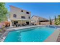 Backyard pool and spa offers a luxurious outdoor experience with ample seating and relaxation areas at 9656 Paraiso Springs St, Las Vegas, NV 89139