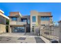 Modern home featuring a gated entrance, clean lines, and an attached garage at 1181 Calle De Luz, Henderson, NV 89012