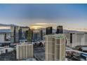 Expansive daytime city view of Las Vegas, highlighted by luxury hotel towers against a mountain backdrop at 145 E Harmon Ave # 3807, Las Vegas, NV 89109