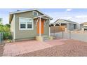 Charming single-story house with orange front door and a small brick landing at 1718 Marlin Ave, Las Vegas, NV 89101
