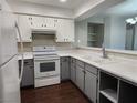 Bright kitchen featuring white appliances, ample counter space and wood look flooring at 2020 Mesquite Ln # 205, Laughlin, NV 89029