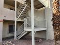 Exterior stairwell with metal railing and stairs leading to second-story condos at 2020 Mesquite Ln # 205, Laughlin, NV 89029
