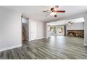 The spacious living room features wood-look flooring, a cozy fireplace, and ample natural light at 2046 Waverly Cir, Henderson, NV 89014