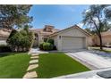 Charming single-story home with a well-manicured lawn and inviting curb appeal at 2529 Seascape Dr, Las Vegas, NV 89128