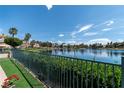 Picturesque lake view from a well-maintained backyard, perfect for relaxation and outdoor activities at 2529 Seascape Dr, Las Vegas, NV 89128