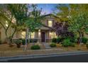 Beautiful two-story house featuring a landscaped front yard at 3141 Monet Sunrise Ave, Henderson, NV 89044