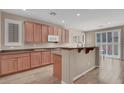 Spacious kitchen featuring stainless steel appliances, hardwood floors, and large counter space at 3141 Monet Sunrise Ave, Henderson, NV 89044