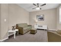 Cozy living room featuring neutral decor and a ceiling fan at 3141 Monet Sunrise Ave, Henderson, NV 89044