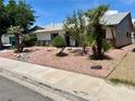 Single-story home with desert landscaping and a well-manicured front yard at 3144 Downing Pl, Las Vegas, NV 89121