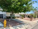 Charming single-story home featuring desert landscaping and a well-maintained front yard at 3144 Downing Pl, Las Vegas, NV 89121