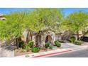 Beautiful exterior of a home with lush green trees providing shade and curb appeal on a sunny day at 3367 Popcorn Flower St, Las Vegas, NV 89117