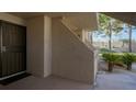 Exterior entrance to a condo featuring a security door and desert landscape at 3791 Desert Marina Dr # 109, Laughlin, NV 89029