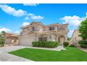 Lovely two-story home featuring a tile roof, and a well maintained front yard with green grass at 3846 Biltmore Bay St, Las Vegas, NV 89147