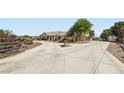 Long concrete driveway leads to this charming home, with a split section and mature trees surrounding at 4075 W Torino Ave, Las Vegas, NV 89139
