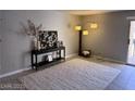Bright living room with modern decor, neutral colors, and lots of natural light at 4965 Indian River Dr # 101, Las Vegas, NV 89103