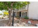Inviting two-story townhome featuring a private balcony and low-maintenance landscaping at 516 Delfern Ln, Las Vegas, NV 89169