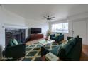 Comfortable living room features stylish furniture and a view of the water at 5335 Rod Ct # 103, Las Vegas, NV 89122