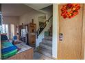 Inviting entryway with staircase and functional furniture at 553 Dutchman Ave, Henderson, NV 89011