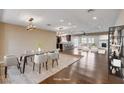 Bright dining room open to kitchen, fireplace, and living spaces at 6117 Foxcroft Ave, Las Vegas, NV 89108